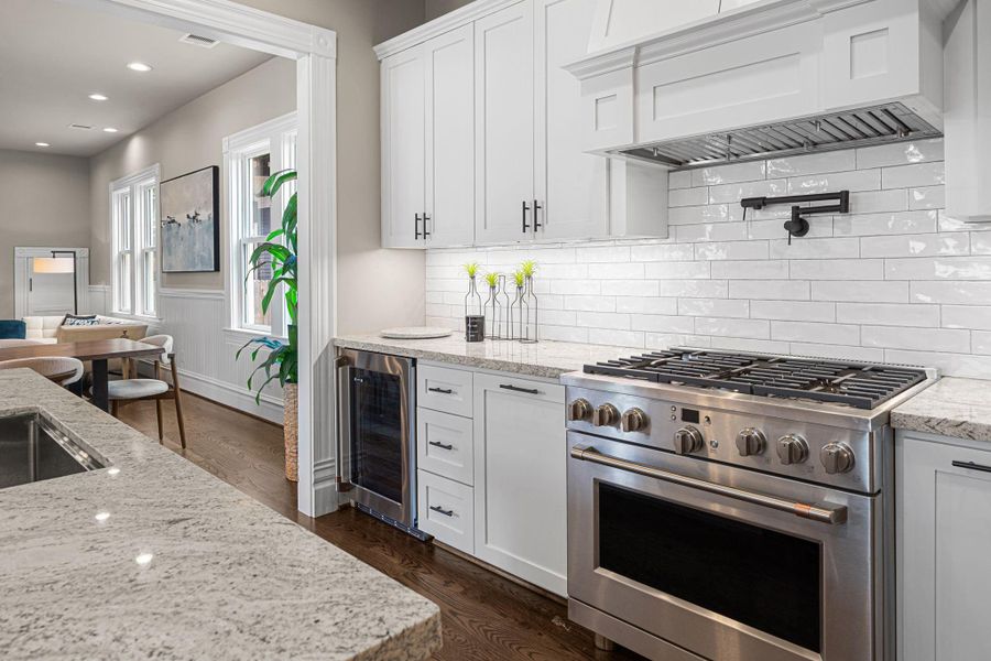 Granite countertops, tile backsplash, all site-built custom wood cabinetry with soft close hinges. Granite countertops, tile backsplash, all site-built custom wood cabinetry with soft close hinges.