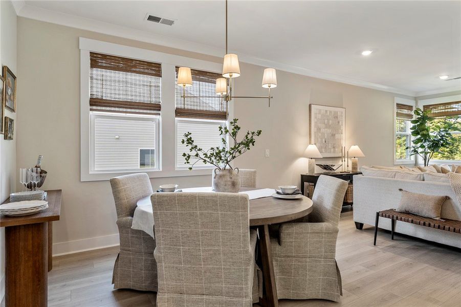 This bright dining area flows seamlessly into the This bright dining area flows seamlessly into the
