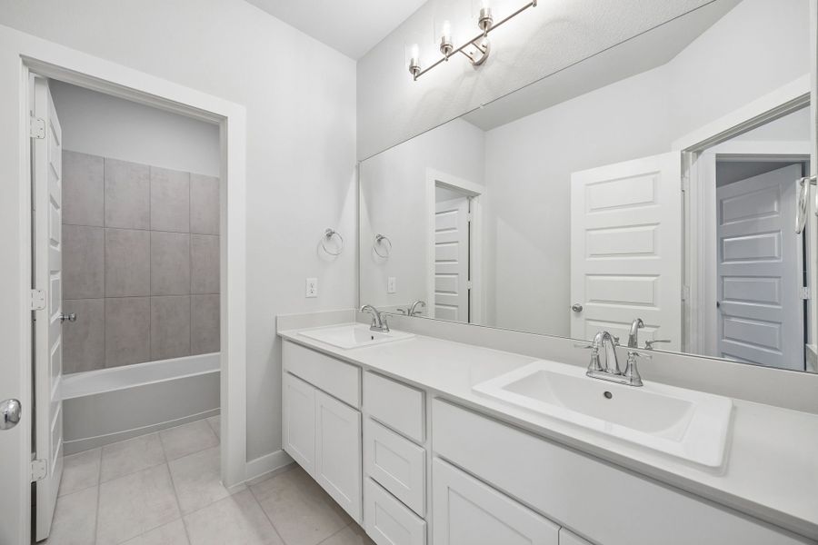 Bathroom in the Winters home plan by Trophy Signature Homes – REPRESENTATIVE PHOTO