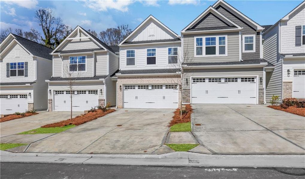 Front exterior of a new home in Villas at Dawsonville Townhomes, Dawsonville, GA, highlighting curb appeal (Image 21). Front exterior of a new home in Villas at Dawsonville Townhomes, Dawsonville, GA, highlighting curb appeal (Image 21).