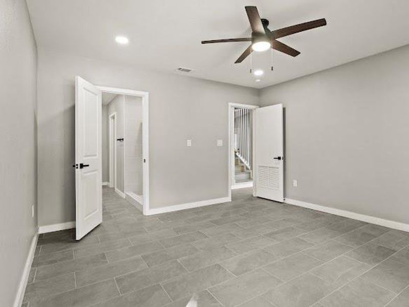 Unfurnished bedroom featuring ceiling fan and recessed lighting