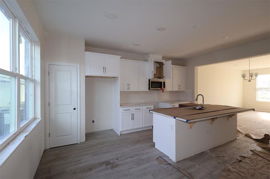 In-progress construction of a new home in Center Lake on the Park, St. Cloud, FL (Image 14).