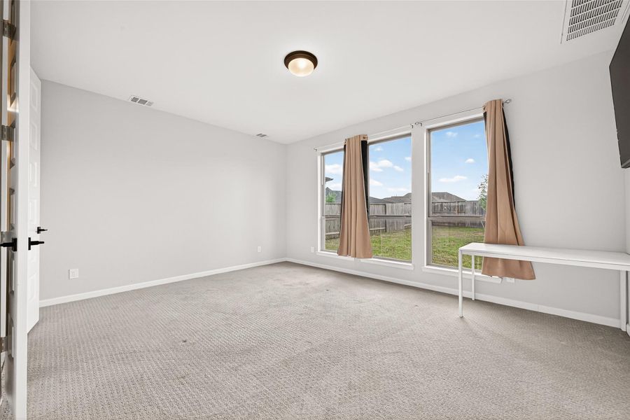Spacious, unfurnished interior of a new home in Cane Island, Katy (Image 21).