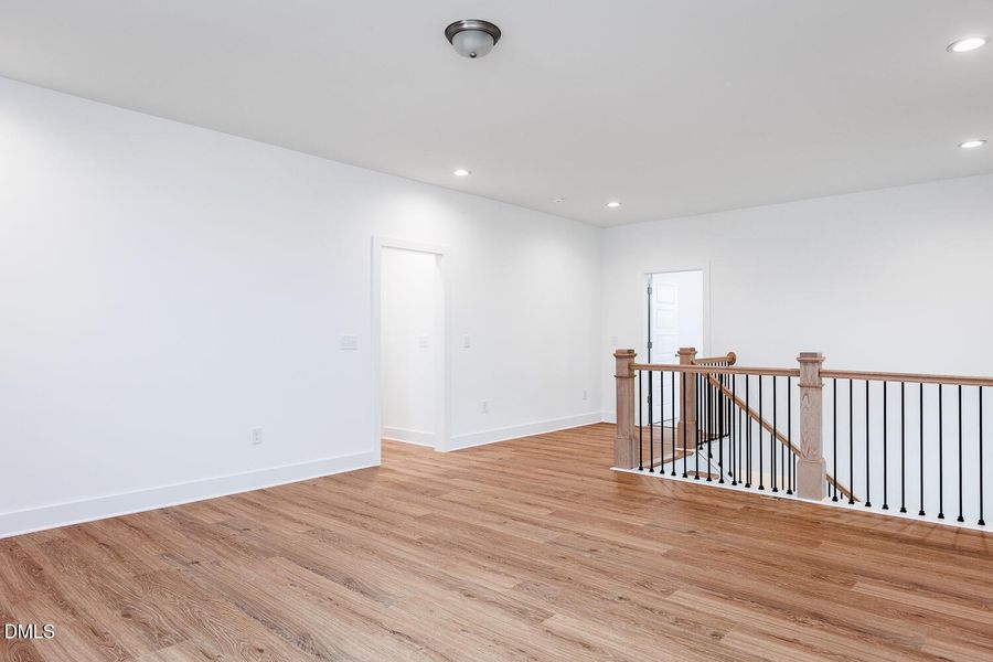 Loft with railing accent