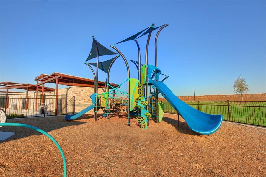 Communal playground featuring fence