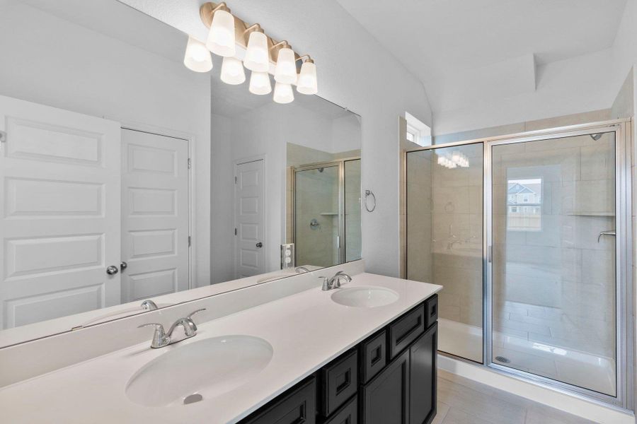 Primary Bath retreat with dual vanities & walk-in shower