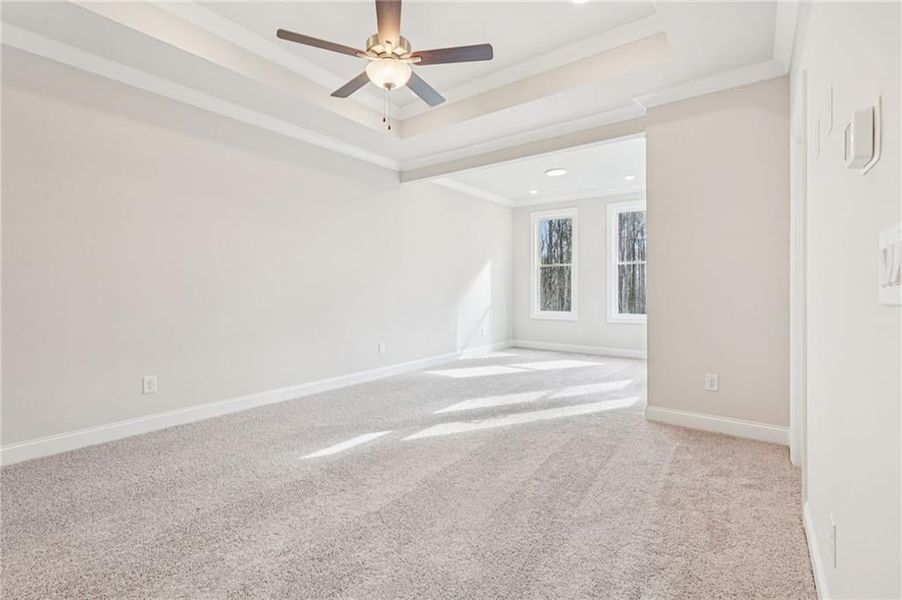 Primary Bedroom is spacious and has sitting room for additional seating.  This space opens to top private deck with the wooded views of the back of the community.  Again- something that you will not find in any other TH community in Alpharetta.
