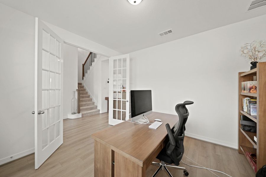 Double French doors provide needed privacy for work calls.