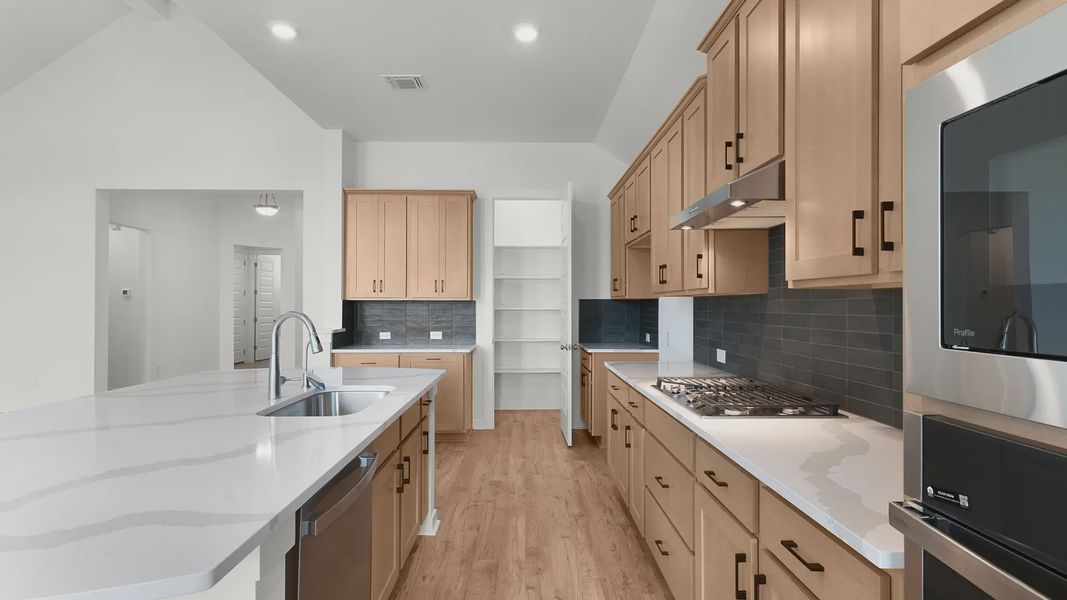 Representative furnished interior of a home built from the Bryson by Chesmar Homes in Newhaven, Manor (Image 6).