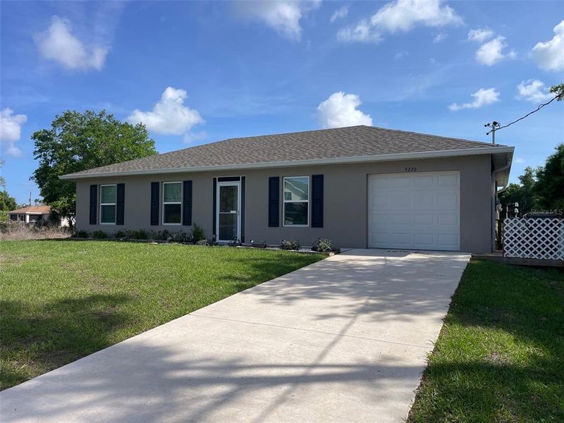 Front exterior of a new home in , North Port, FL, highlighting curb appeal (Image 1). Front exterior of a new home in , North Port, FL, highlighting curb appeal (Image 1).