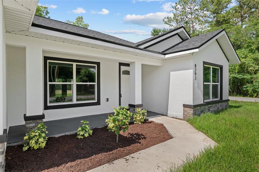 Front exterior of a new home in , Summerfield, FL, highlighting curb appeal (Image 23).