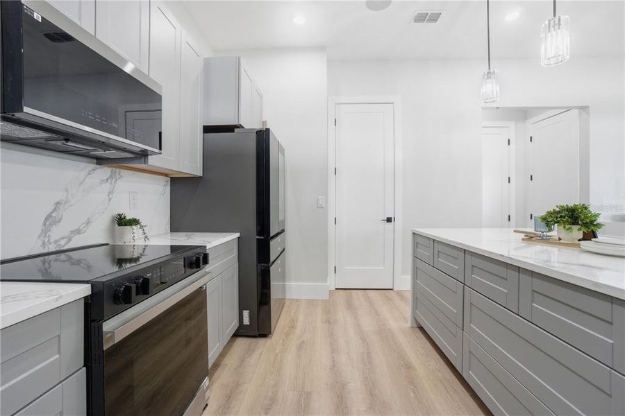Furnished interior view inside a new home in , Belle Isle (Image 17).