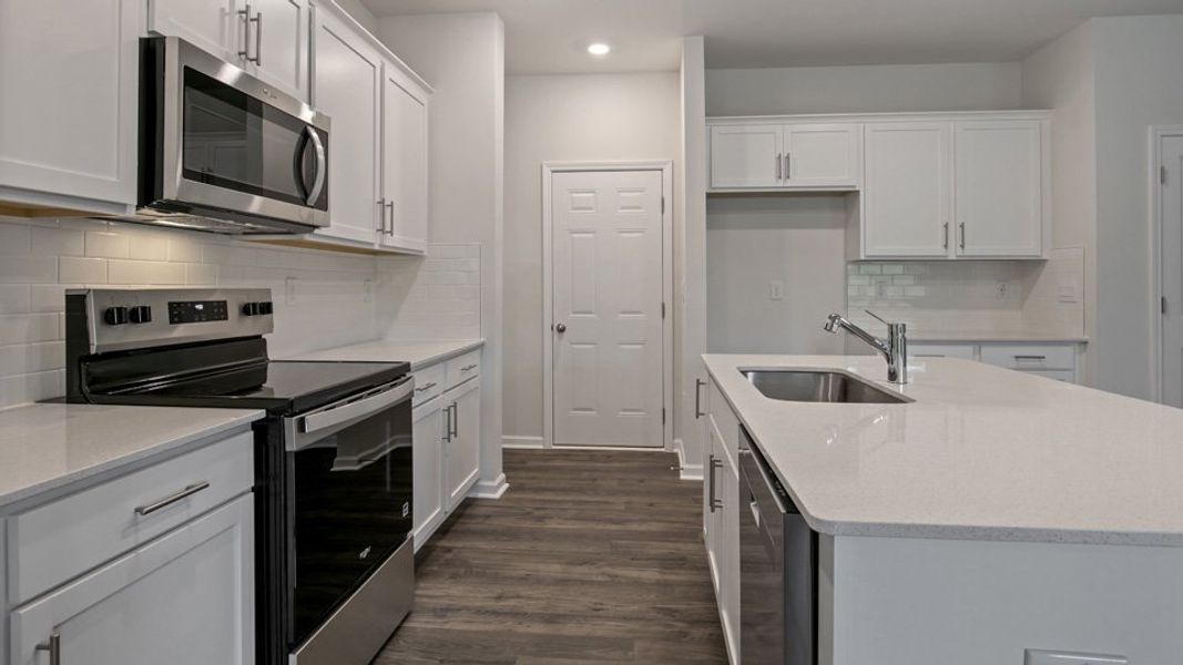 Furnished interior view inside a new home in The Grove at Matthews Landing, Fuquay Varina (Image 5).