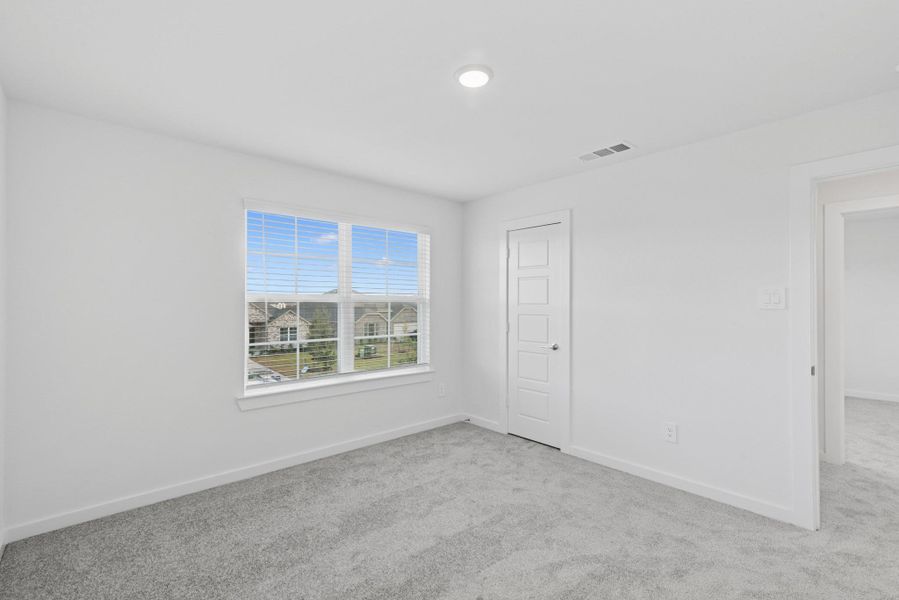 Spacious, unfurnished interior of a new home in Pinewood at Grand Texas, New Caney (Image 17).