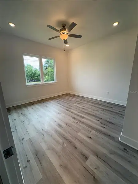 Spacious, unfurnished interior of a new home in , Port Charlotte (Image 9).