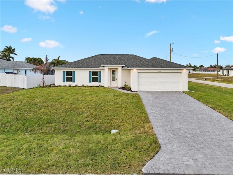 Front exterior of a new home in Cape Coral, Cape Coral, FL, highlighting curb appeal (Image 2). Front exterior of a new home in Cape Coral, Cape Coral, FL, highlighting curb appeal (Image 2).