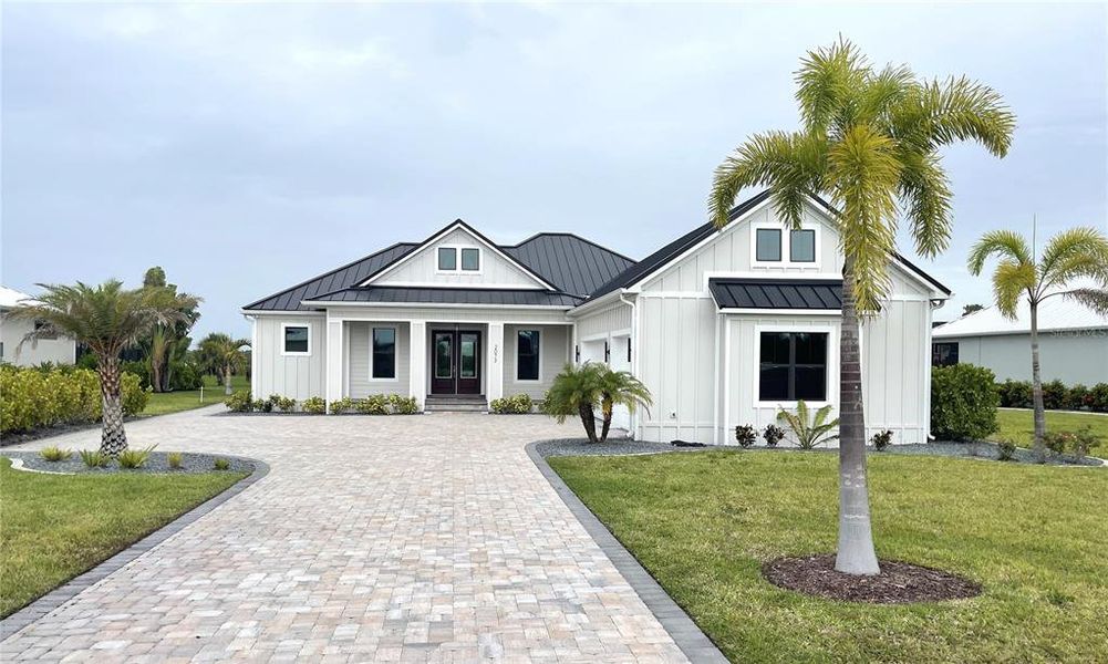 Front exterior of a new home in , Punta Gorda, FL, highlighting curb appeal (Image 1).