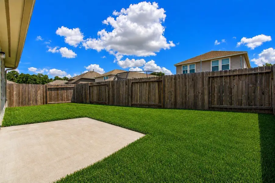 Rear back yard is large and has a very nice concrete pad that is ideal for outdoor entertaining, cooking the Q, the size of the pad is 13X9