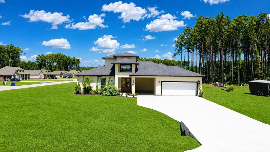 Front exterior of a new home in , Dayton, TX, highlighting curb appeal (Image 2). Front exterior of a new home in , Dayton, TX, highlighting curb appeal (Image 2).