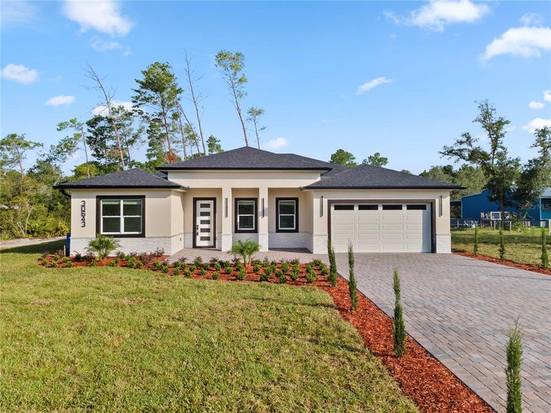 Front exterior of a new home in , Eustis, FL, highlighting curb appeal (Image 2). Front exterior of a new home in , Eustis, FL, highlighting curb appeal (Image 2).