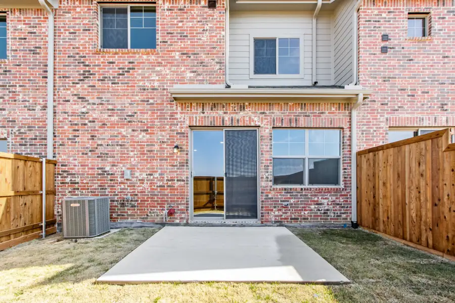 Exterior details and patio area of a home in Wildridge, Oak Point (Image 4).