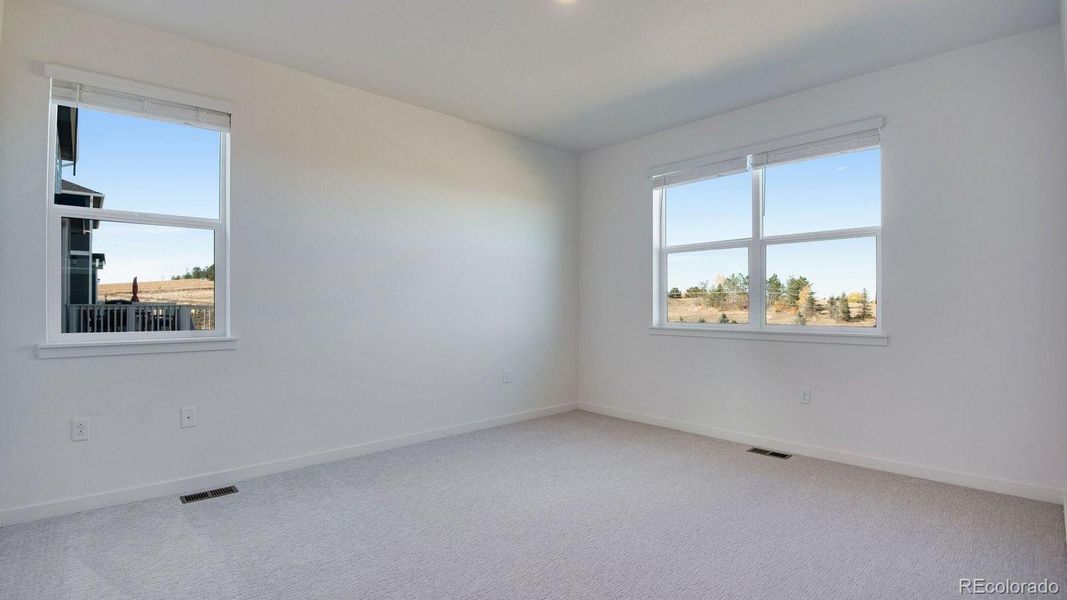 Spacious, unfurnished interior of a new home in Trails at Crowfoot, Parker (Image 30).