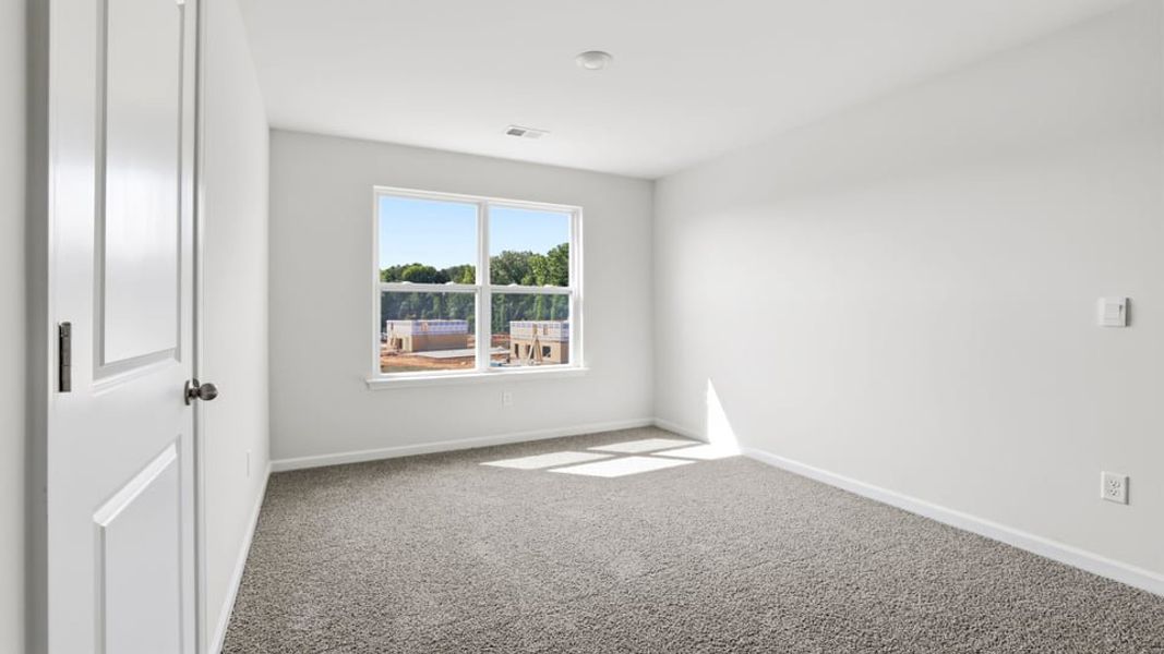 Spacious, unfurnished interior of a new home in Bentley Park, Greenwood (Image 24).