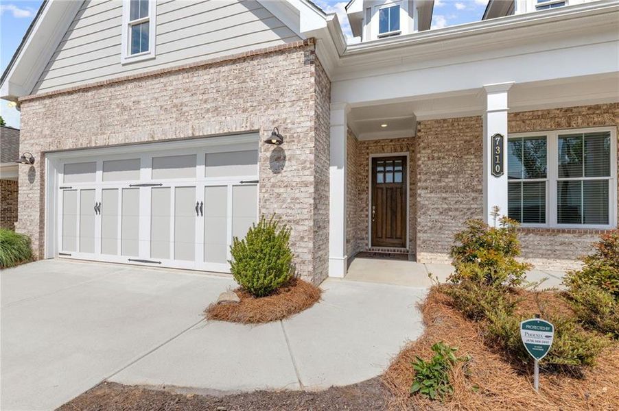 Exterior details and patio area of a home in Courtyards at Traditions, Cumming (Image 4).