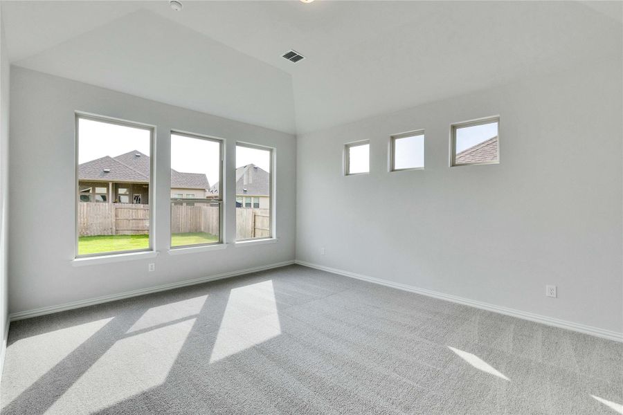 Spare room featuring carpet and baseboards Spare room featuring carpet and baseboards