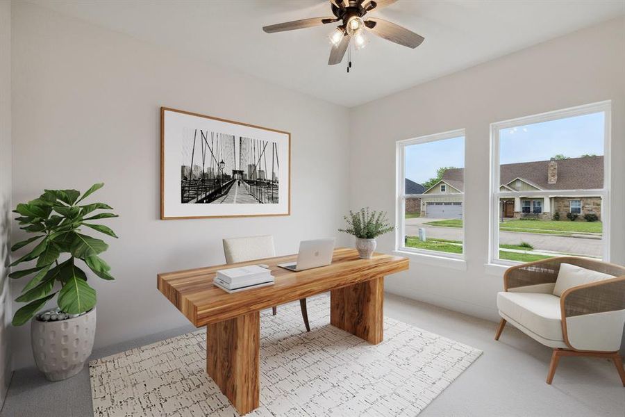 Office space with a ceiling fan and light colored carpet