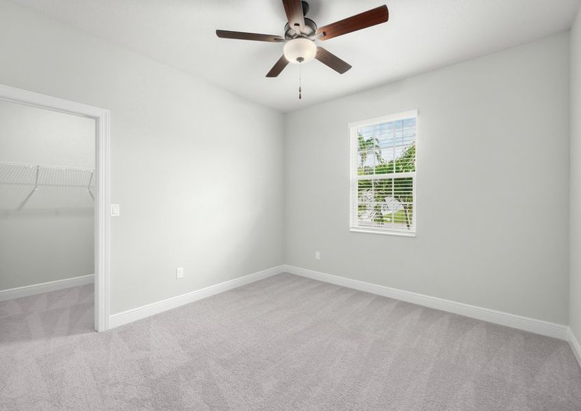 One of the secondary bedrooms that comes with lush carpeting