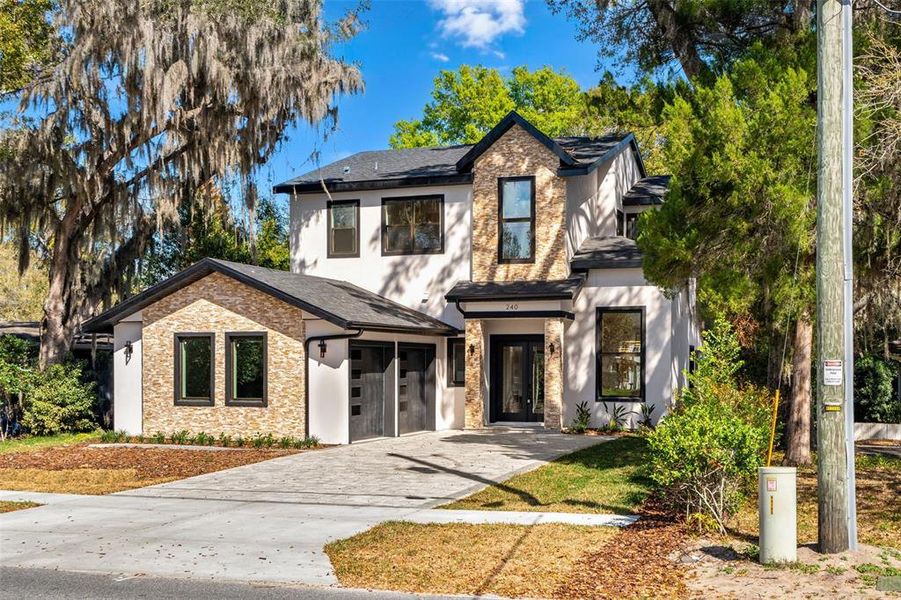 Front exterior of a new home in , Winter Park, FL, highlighting curb appeal (Image 32).