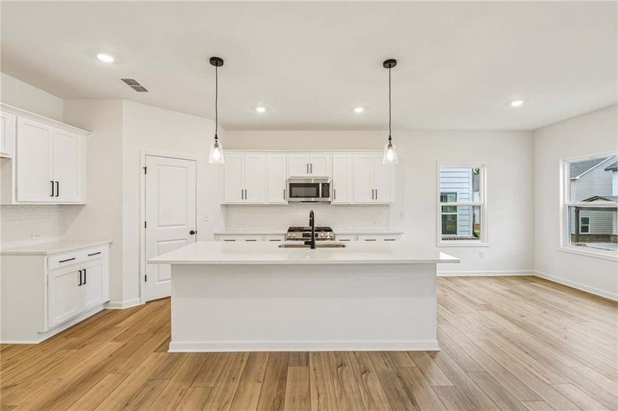 Furnished interior view inside a new home in Eastlyn Crossing, Flowery Branch (Image 8).