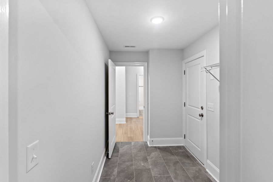 Representative unfurnished interior of a home built from the Sand Dune by Bill Clark Homes in Osprey Landing, Southport (Image 26).