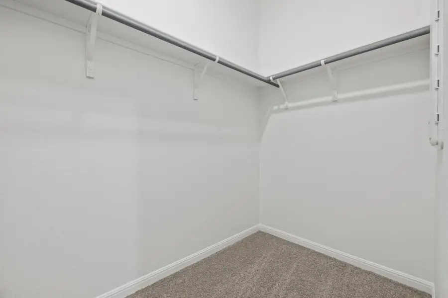 Primary Closet in the Birch home plan by Trophy Signature Homes – REPRESENTATIVE PHOTO