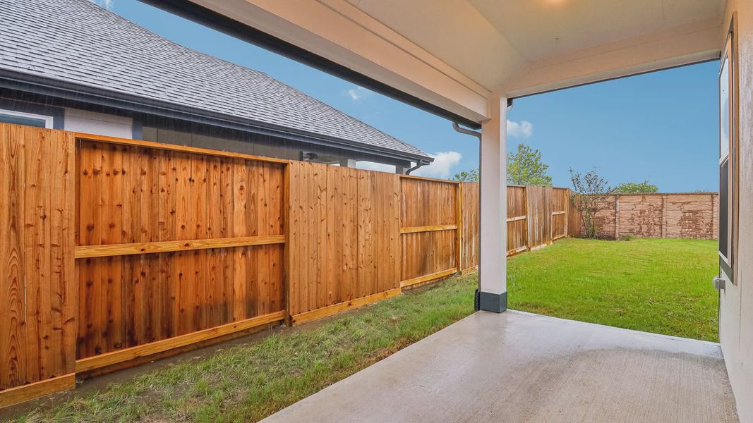 Exterior details and patio area of a home in Meridiana Townhomes, Manvel (Image 27).