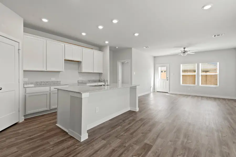 A kitchen with white cabinets. A kitchen with white cabinets.