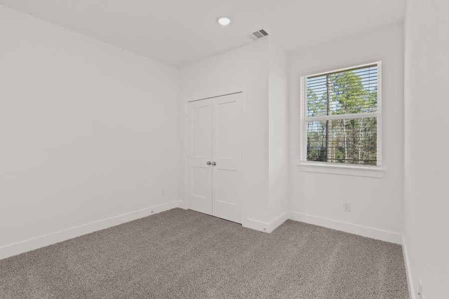 Representative unfurnished interior of a home built from the Cheverny by Chesmar Homes in Santa Rita Ranch, Liberty Hill (Image 14).