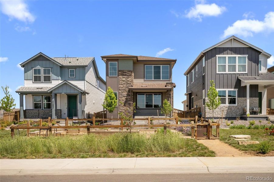 Front exterior of a new home in Painted Prairie, Aurora, CO, highlighting curb appeal (Image 26).