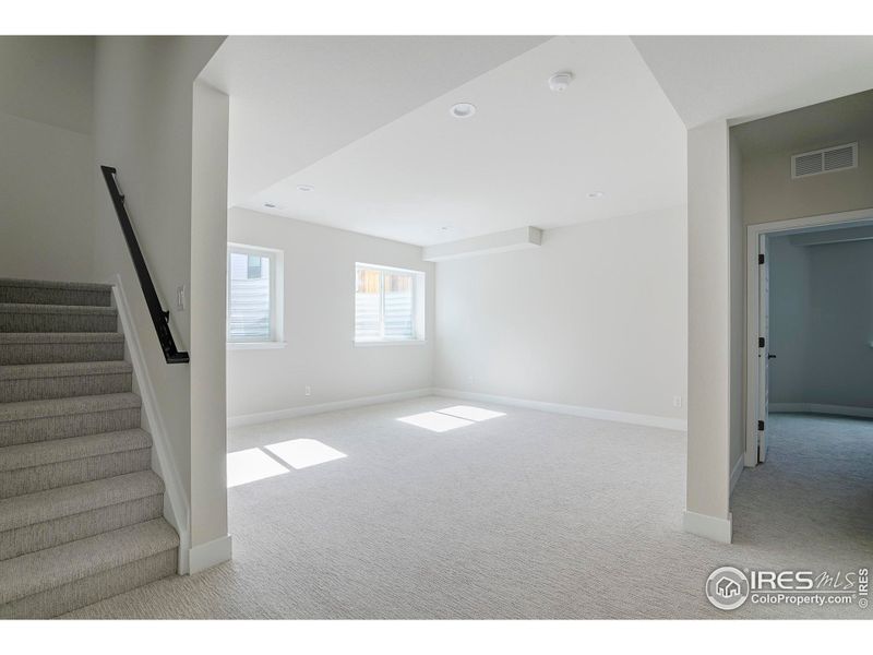 Lower level recreation room with daylight egress windows