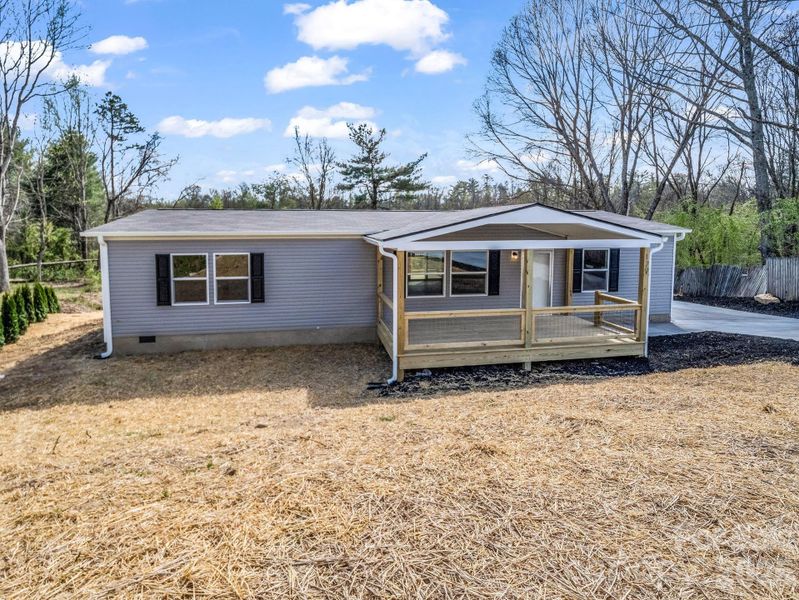 Exterior details and patio area of a home in , East Flat Rock (Image 19).