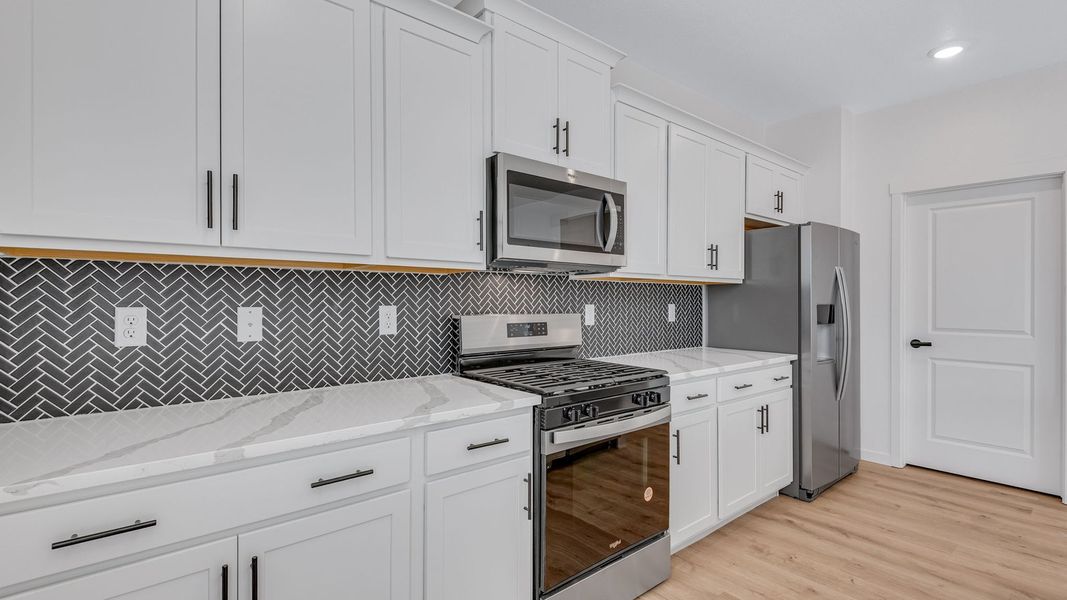Representative furnished interior of a home built from the Bridgeport by D.R. Horton in Hansen Farm, Fort Collins (Image 6).