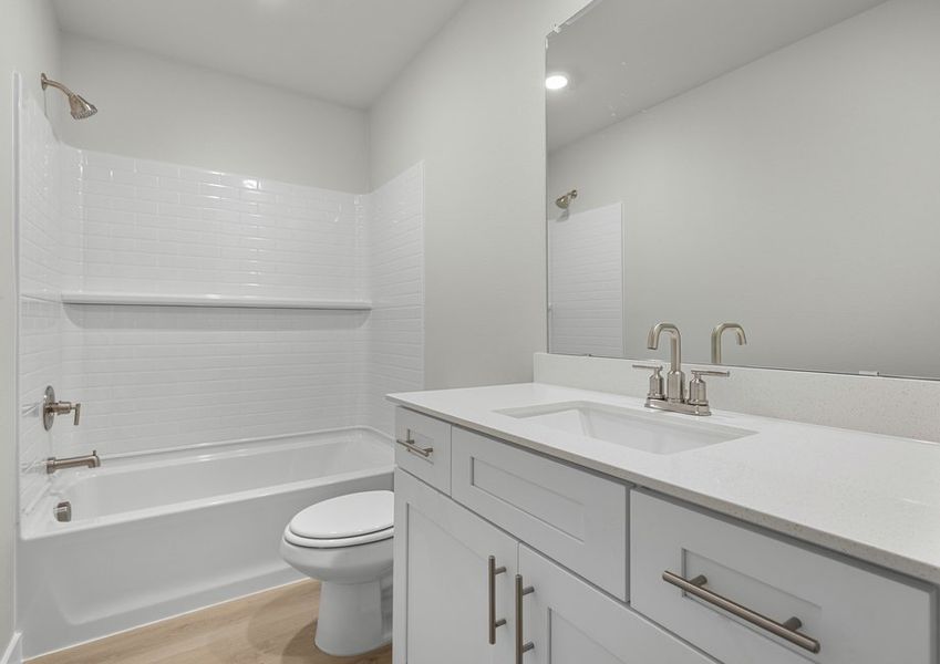 Secondary bedroom with white cabinetry and shower/tub combo. Secondary bedroom with white cabinetry and shower/tub combo.
