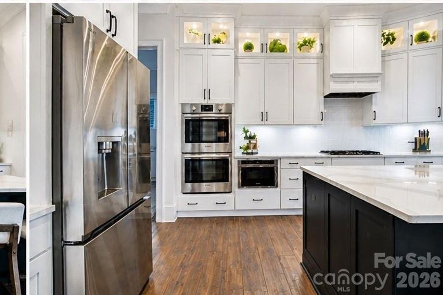 Double oven, drawer microwave, and gas range with hood