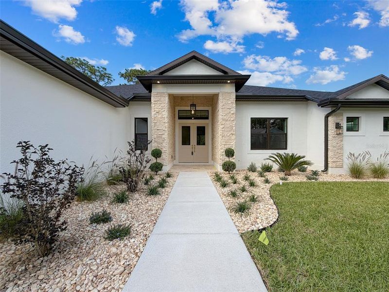 Front exterior of a new home in , Homosassa, FL, highlighting curb appeal (Image 1). Front exterior of a new home in , Homosassa, FL, highlighting curb appeal (Image 1).