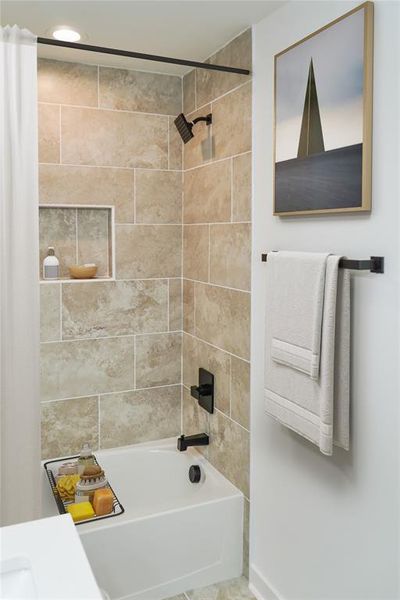 Full bathroom featuring shower / washtub combination and baseboards Full bathroom featuring shower / washtub combination and baseboards