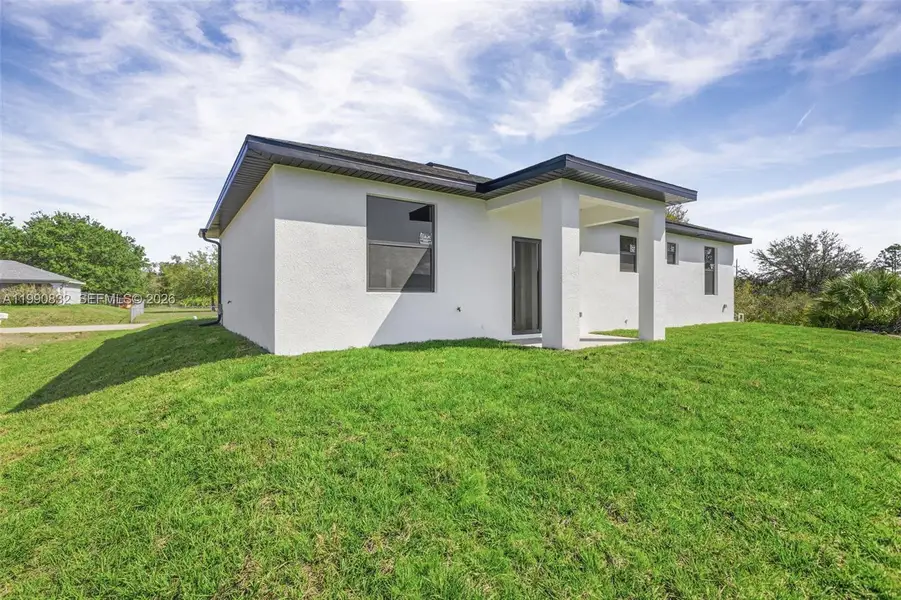 Exterior details and patio area of a home in , Lehigh Acres (Image 3).