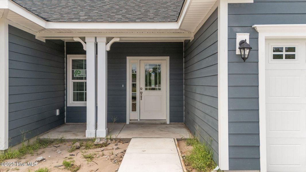 Front exterior of a new home in Rutledge, Shallotte, NC, highlighting curb appeal (Image 2).