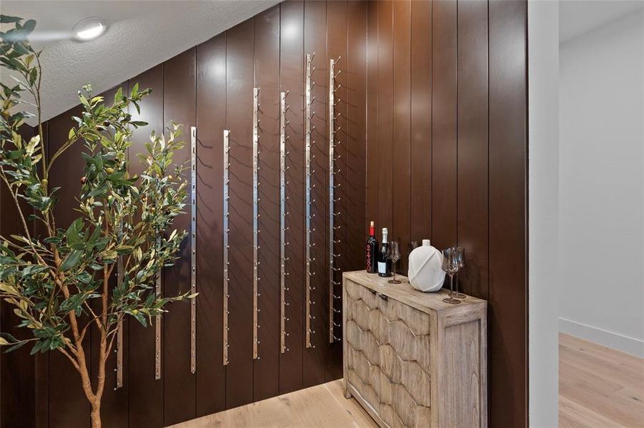 Wine wall - check out the hidden storage room behind the tree