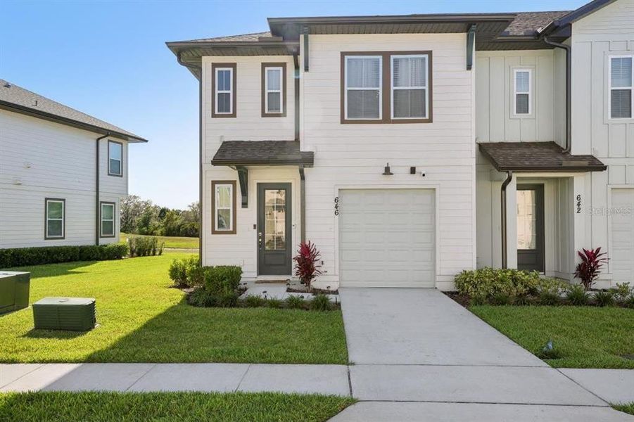 Front exterior of a new home in , Davenport, FL, highlighting curb appeal (Image 1). Front exterior of a new home in , Davenport, FL, highlighting curb appeal (Image 1).